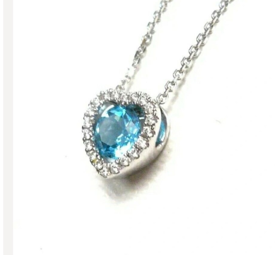 Sold. 14K White Gold Blue Topaz set in a Heart Shaped Pendant with a Diamond Halo Around the Blue Topaz