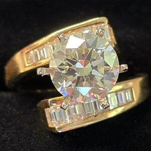 14K Yellow Gold Channel set Diamond Baguette Ring Setting. The Center Prongs will Hold a 2.75 ct. to 3.00 cts.