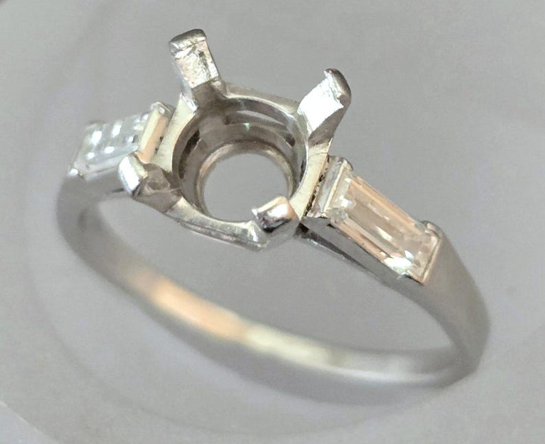 Vintage Platinum Baguette Diamond Ring or Engagement Ring Setting for an approximate 0.75 carat size diamond or Gem. The ring is a Size 7.50