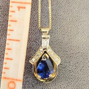 14K Gold Pear Shaped Natural Sapphire Pendant accented with Diamonds. Comes with a 14K Gold Chain or without for less
