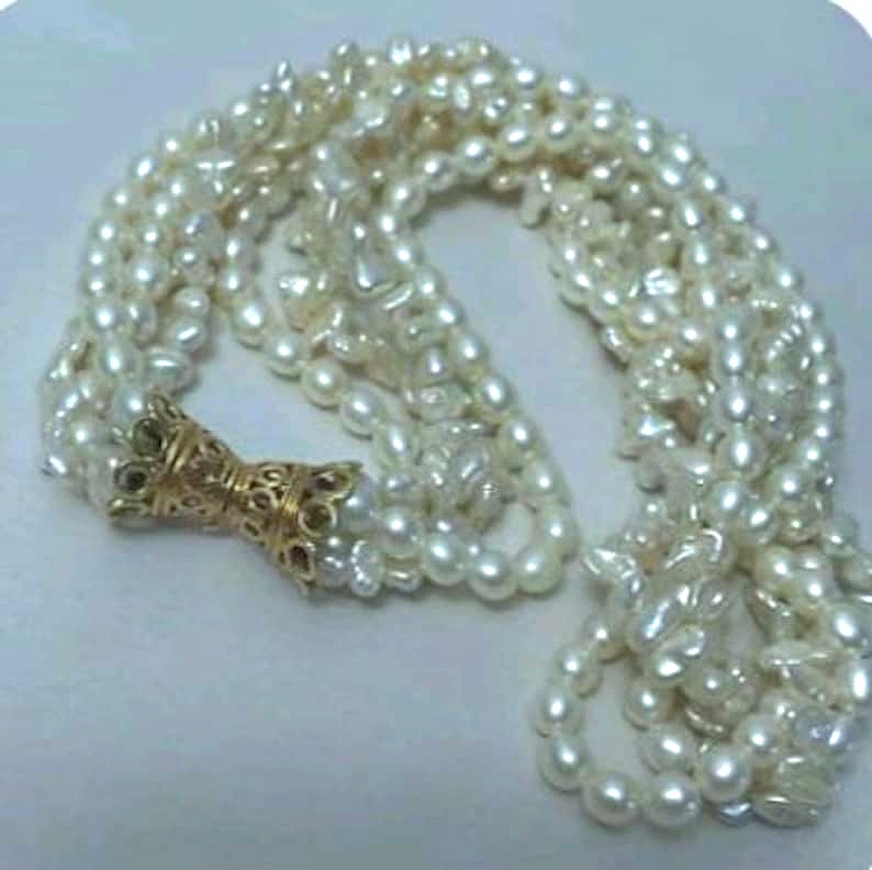 Multi Strand Freshwater Pearl Necklace with a 14K Yellow Gold Fancy Bow Shaped Clasp
